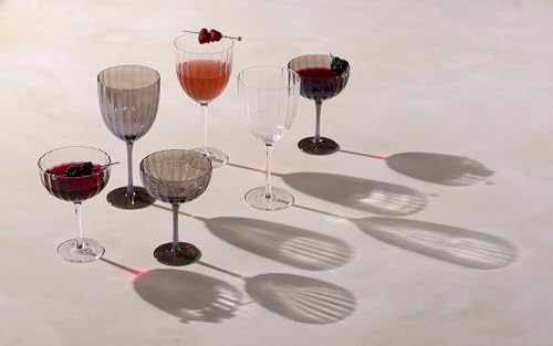 Set of four Lenox Curva Luxe coupe cocktail glasses with elegant, curved design, clear glassware for stylish beverages.