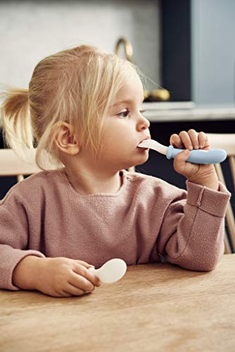 BabyBjörn Baby Feeding Set in powder pink, 4-piece flatware set with spoon, fork, and utensils for babies.