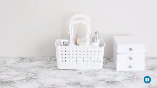 Clear frost iDesign shower caddy for small bathrooms, featuring multiple compartments for organizing shower essentials