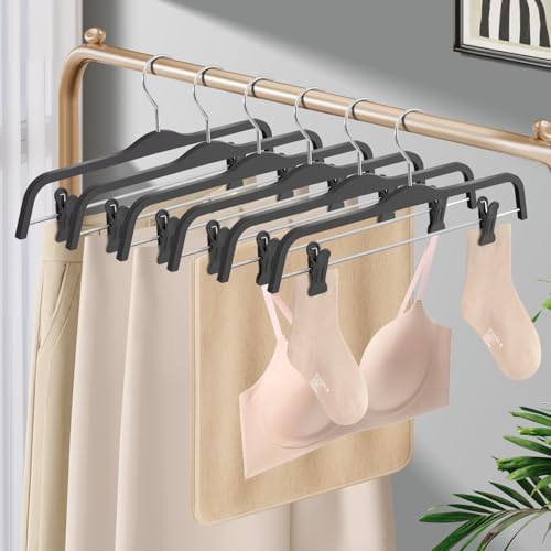 Set of 10 HUADYMEET 14-inch grey pants skirt hangers with adjustable clips for organizing skirts and pants.