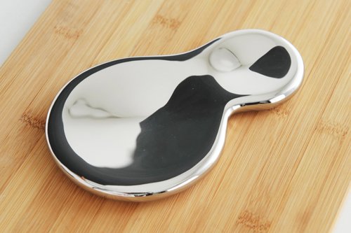 Alessi T-1000 stainless steel mirror polished spoon rest, sleek silver kitchen accessory for keeping utensils tidy.