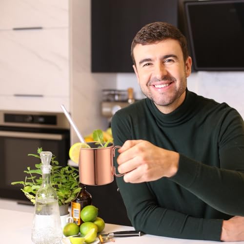 Set of four SiliFine 16.9 oz copper Moscow Mule mugs with handles, featuring hammered finish and traditional design.