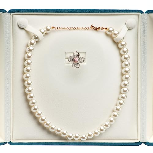 Blue velvet jewelry box from COWFEX with a big chunky pearl necklace and ring inside, ideal for gift storage and organization.