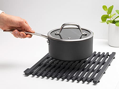 Brabantia extendable dark gray silicone dish drying rack with draining tray, heat resistant and ideal for drying dishes and utensils.