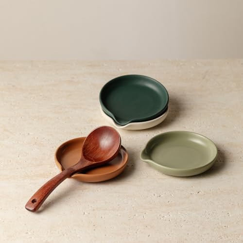 Set of four Vrutaoci ceramic spoon rests for holding spoons, spatulas, whisks, and ladles on stove tops.