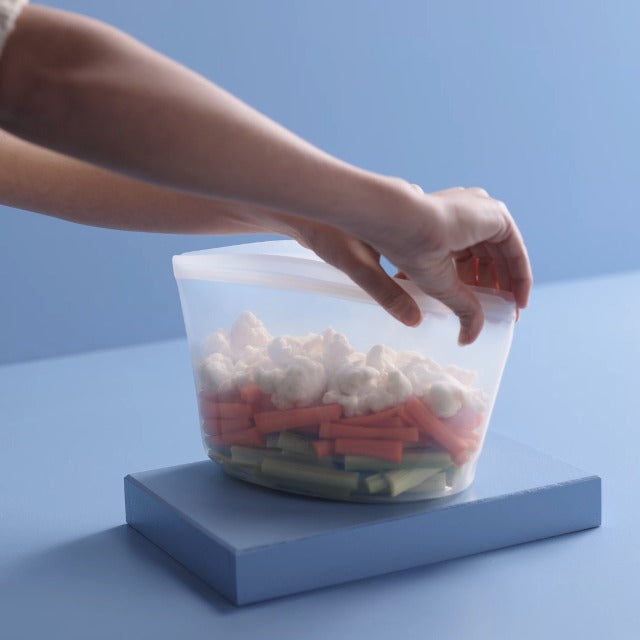 Clear Stasher reusable silicone food storage bowl with 8-cup capacity, leak-proof design, and flexible silicone material.
