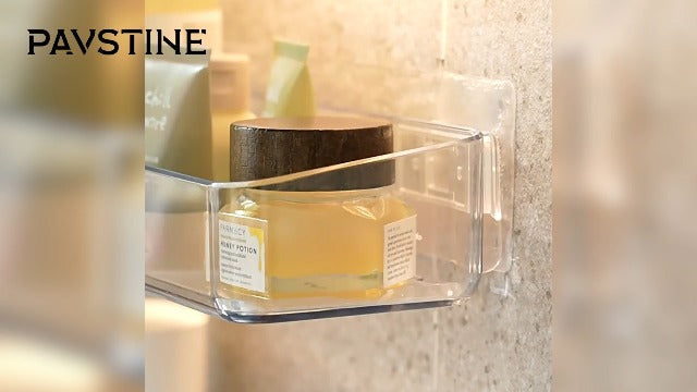 Two clear PAVSTINE shower caddies mounted on bathroom wall, large and tall, for organizing shower essentials.