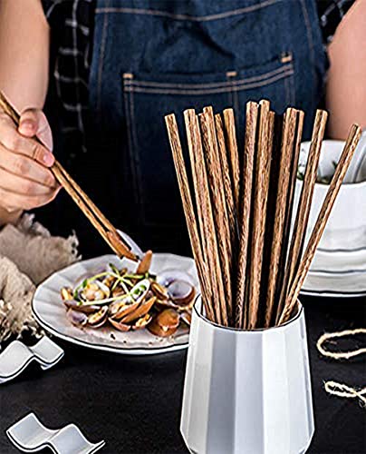 Set of 50 reusable wooden chopsticks, 9.8 inches long, from Arit Estelleshows, arranged in a neat pile for dining use.