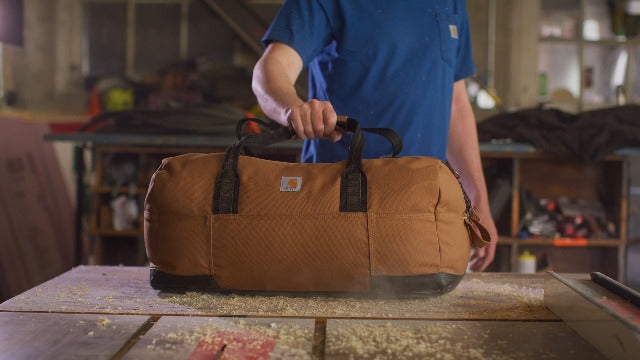 Carhartt insulated navy lunch cooler with two compartments, fully insulated for keeping food and drinks cold, durable and portable.