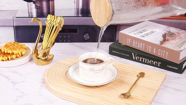 Gold Swan base with 12 coffee and espresso spoons set, featuring 6-inch gold swan-shaped holders and matching coffee spoons.