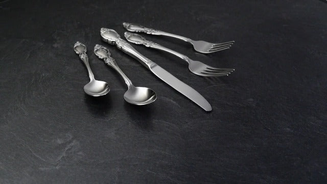 Set of four Oneida Louisiana teaspoons in stainless steel, part of a silverware flatware set for four.