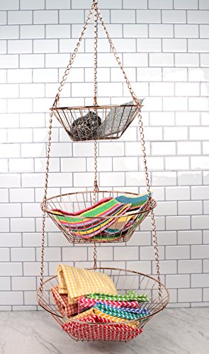 RSVP International hanging copper wire storage baskets, 3-tier collection, mounted on a wall for organized kitchen or living space storage