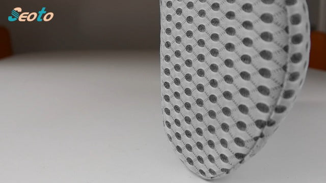 Grey Panduo lumbar support pillow for office chairs, made of memory foam to relieve lower back pain and improve posture.