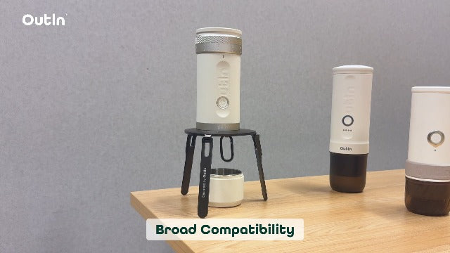 OutIn ultra-portable foldable coffee stand with carabiner, designed for pod storage and easy carrying during outdoor activities.