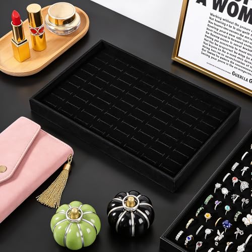 Three stackable velvet jewelry trays with 300 slots for rings, made by PercyEffie, arranged neatly on a display board.