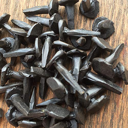 5/8-inch wrought rose head clavos masonry nail in antique black forged iron with faceted decorative head