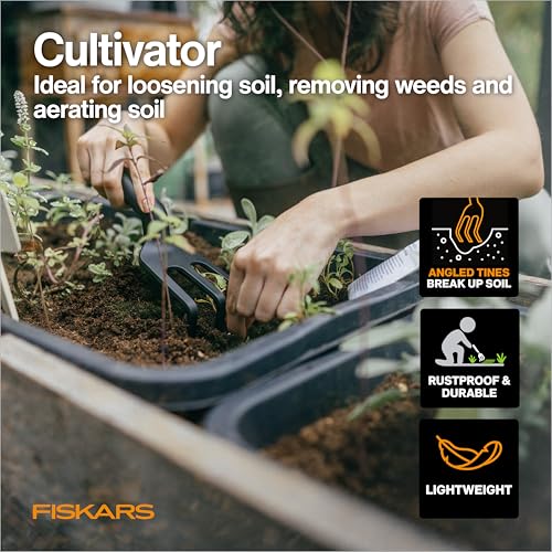 Fiskars 4-piece houseplant tool set with pruning shears, trowel, cultivator, and L/XL gloves