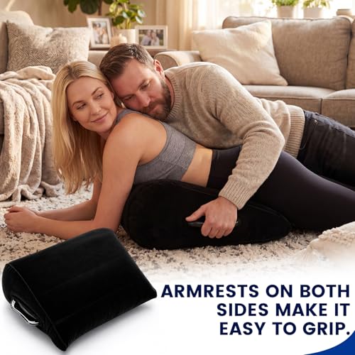 Black inflatable velvet wedge pillow with dual handles, designed for body positioning and comfort by Jamntower.