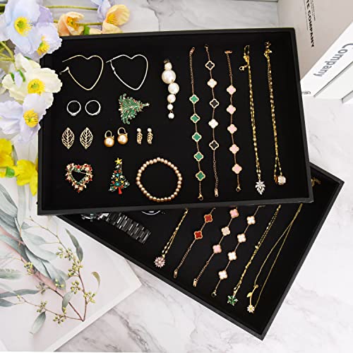 Two black velvet stackable jewelry trays for necklaces, bracelets, and rings, with empty compartments for organized display.