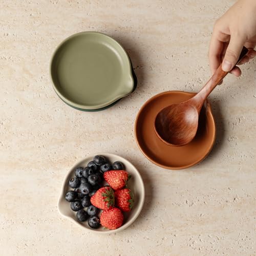 Set of four Vrutaoci ceramic spoon rests for holding spoons, spatulas, whisks, and ladles on stove tops.