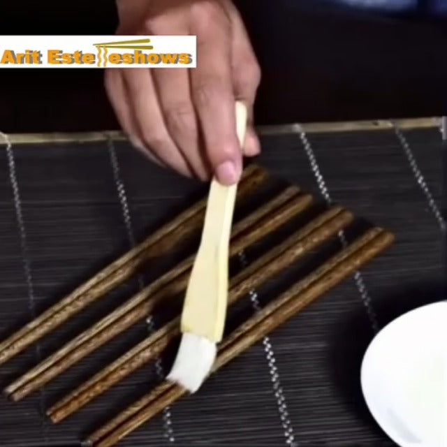 Set of 50 reusable wooden chopsticks, 9.8 inches long, from Arit Estelleshows, neatly arranged on a flat surface.