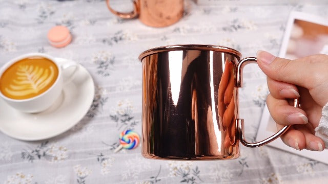 SiliFine 4-pack copper Moscow Mule mugs with handles, 16.9 oz capacity, featuring a polished finish and classic design.