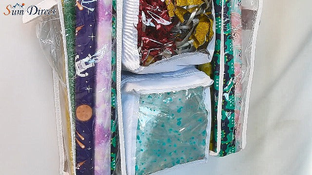 White SumDirect double-sided gift wrap organizer with hanging pockets for wrapping paper and gift bag storage.