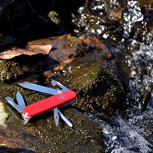 Red Victorinox Tinker multitool with multiple folding tools closed beside its red handle