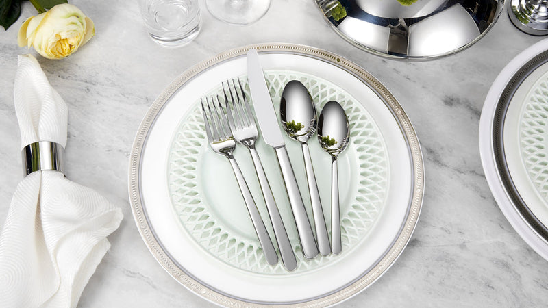 Set of eight KEAWELL Premium Aline 8.3-inch dinner forks arranged on a white table setting for dining.
