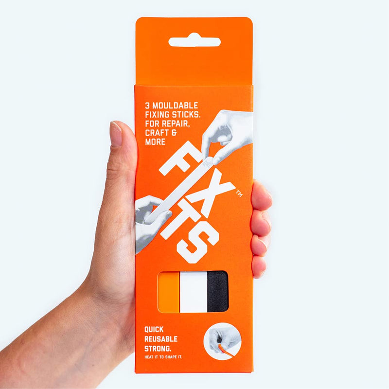 [Australia - AusPower] - Pack of 3 Large 10g Fixits Sticks - Reusable Glue Stick Alternative - Plastic Fixing Sticks for Everyday Fixes - Mouldable Glue for Repairing, Crafting, Creating - Ideal DIY Tool or Sustainable Gift Pack of 3 sticks Black, White, Orange 