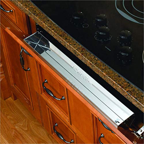 Rev-A-Shelf 6581 Series 25-inch stainless steel tip-out tray for kitchen cabinet storage and organization.