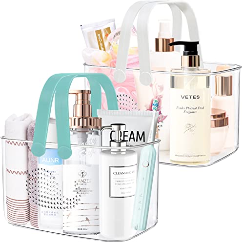 Two FODIENS plastic shower caddy baskets in white and cyan for bathroom storage, featuring open design with handles.