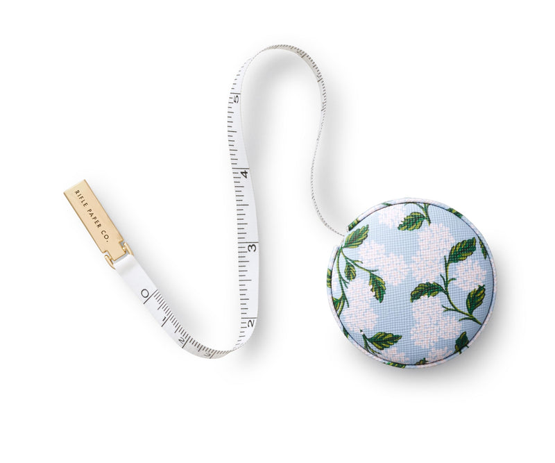 RIFLE PAPER CO. Measuring Tape | Retractable Measures up to 60" (152.4 CM), Retractable, Hidden Button Release, Brass Hardware (Perfect for Mom, Home, Office, On-The-Go, Desk), Hydrangea