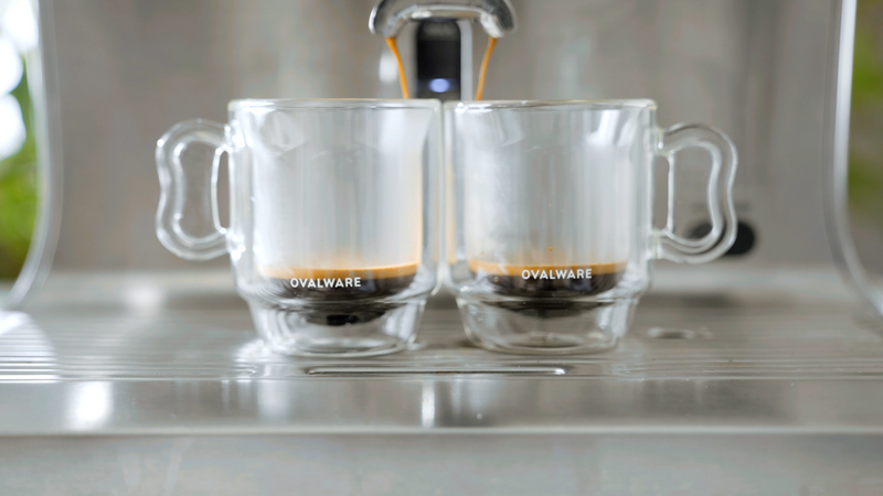 Set of four Ovalware 4oz espresso coffee cups with butterfly handles, featuring a sleek oval design and elegant style.