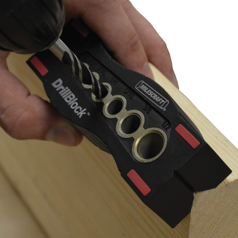 Milescraft 1312 DrillBlock handheld drill guide for precise drilling, part of Milescraft tool sets, shown in use.