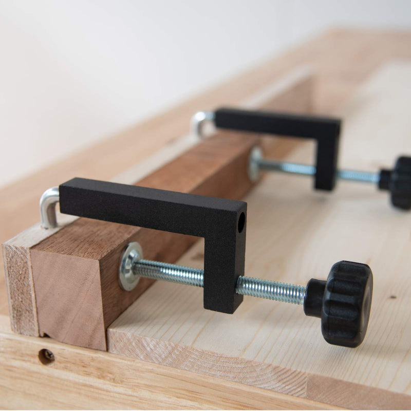 PowerTec 71004 universal fence clamps, a 2-pack of black C-clamps for woodworking and workshop securing tasks.