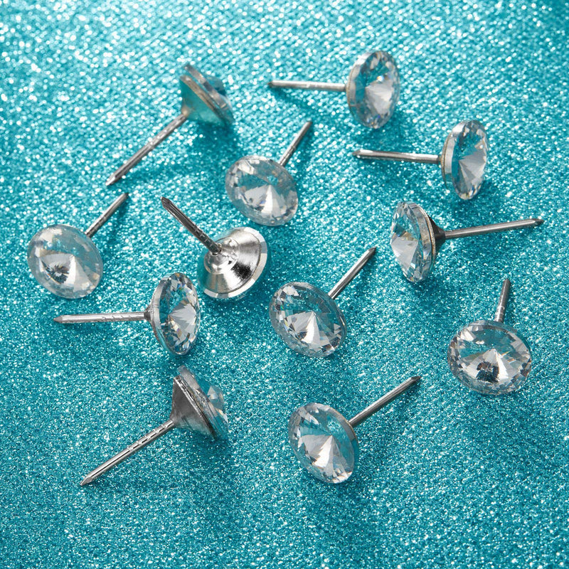 Set of 30 Zonon diamond crystal upholstery tacks with crystal heads, 25 mm decorative furniture push pins on a cork board.